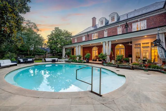 a view of a swimming pool with chairs