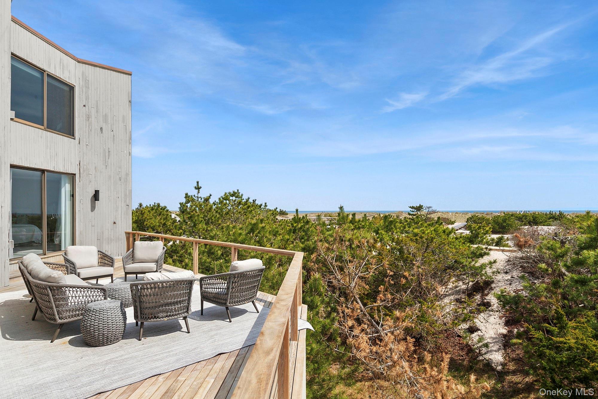 199 Dune Road Westhampton Beach, NY 11978 - Photo 13 of 38 a view of a terrace with furniture