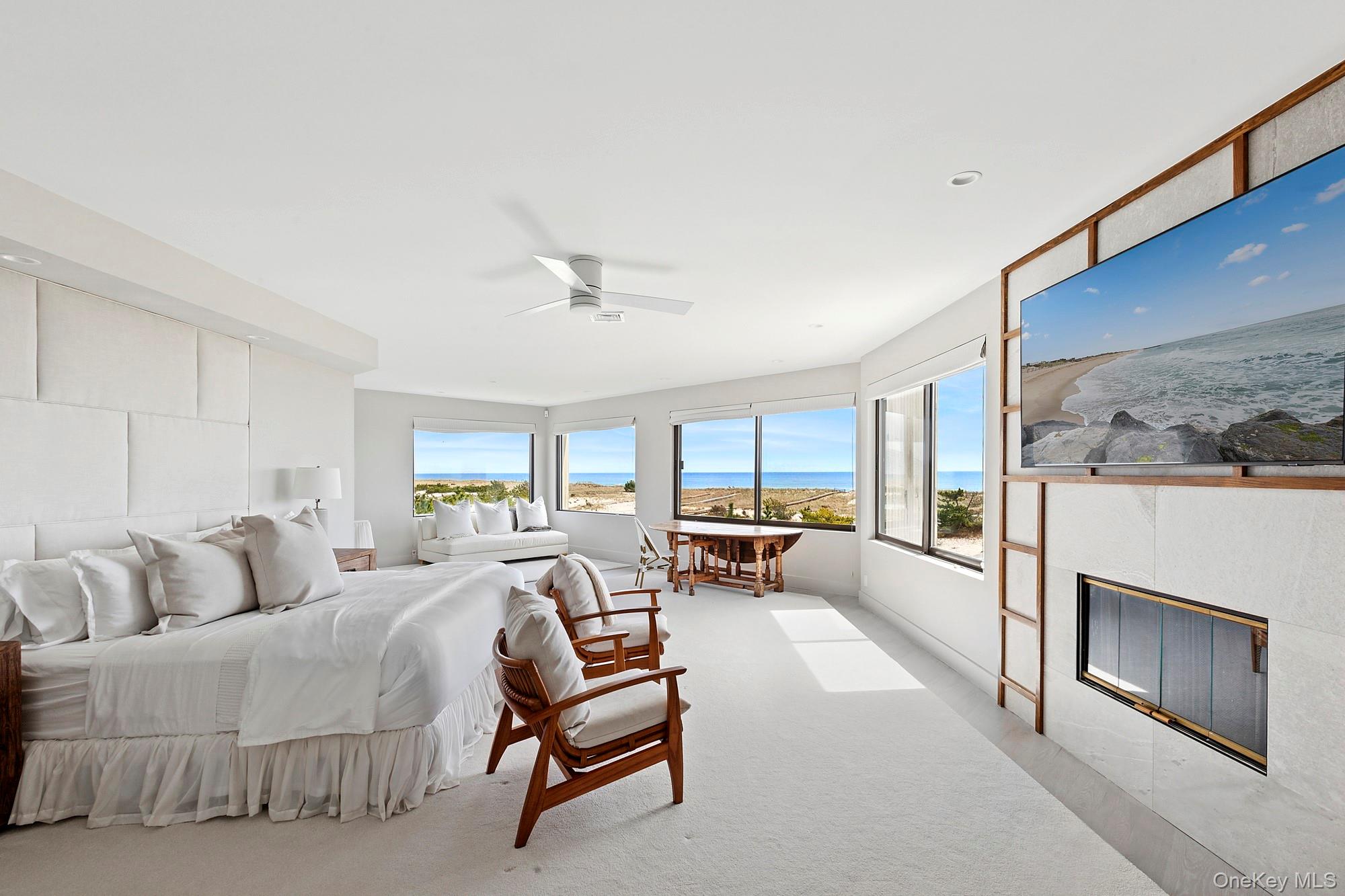 199 Dune Road Westhampton Beach, NY 11978 - Photo 14 of 38 a living room with furniture and a fireplace