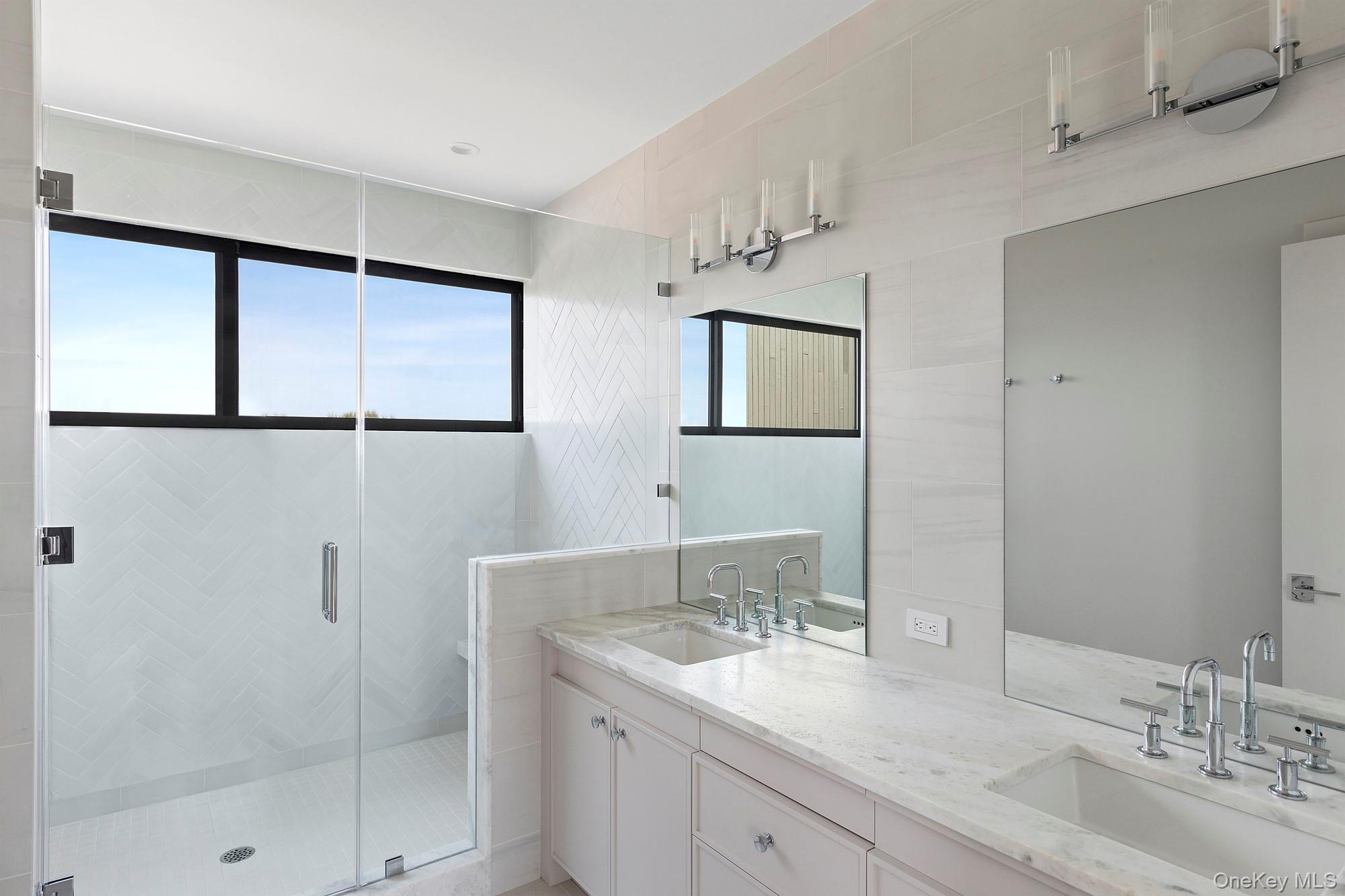 199 Dune Road Westhampton Beach, NY 11978 - Photo 16 of 38 a bathroom with a granite countertop sink mirror and double