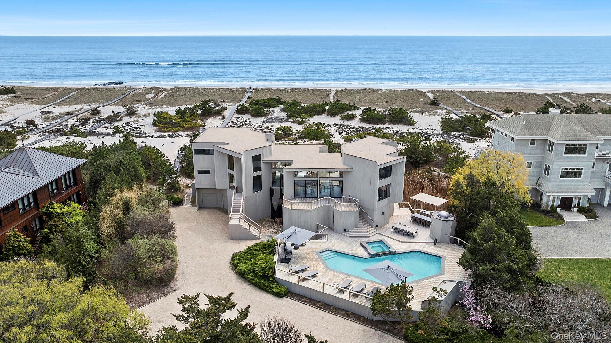 199 Dune Road Westhampton Beach, NY 11978 - Photo 32 of 38 an aerial view of a house with a yard