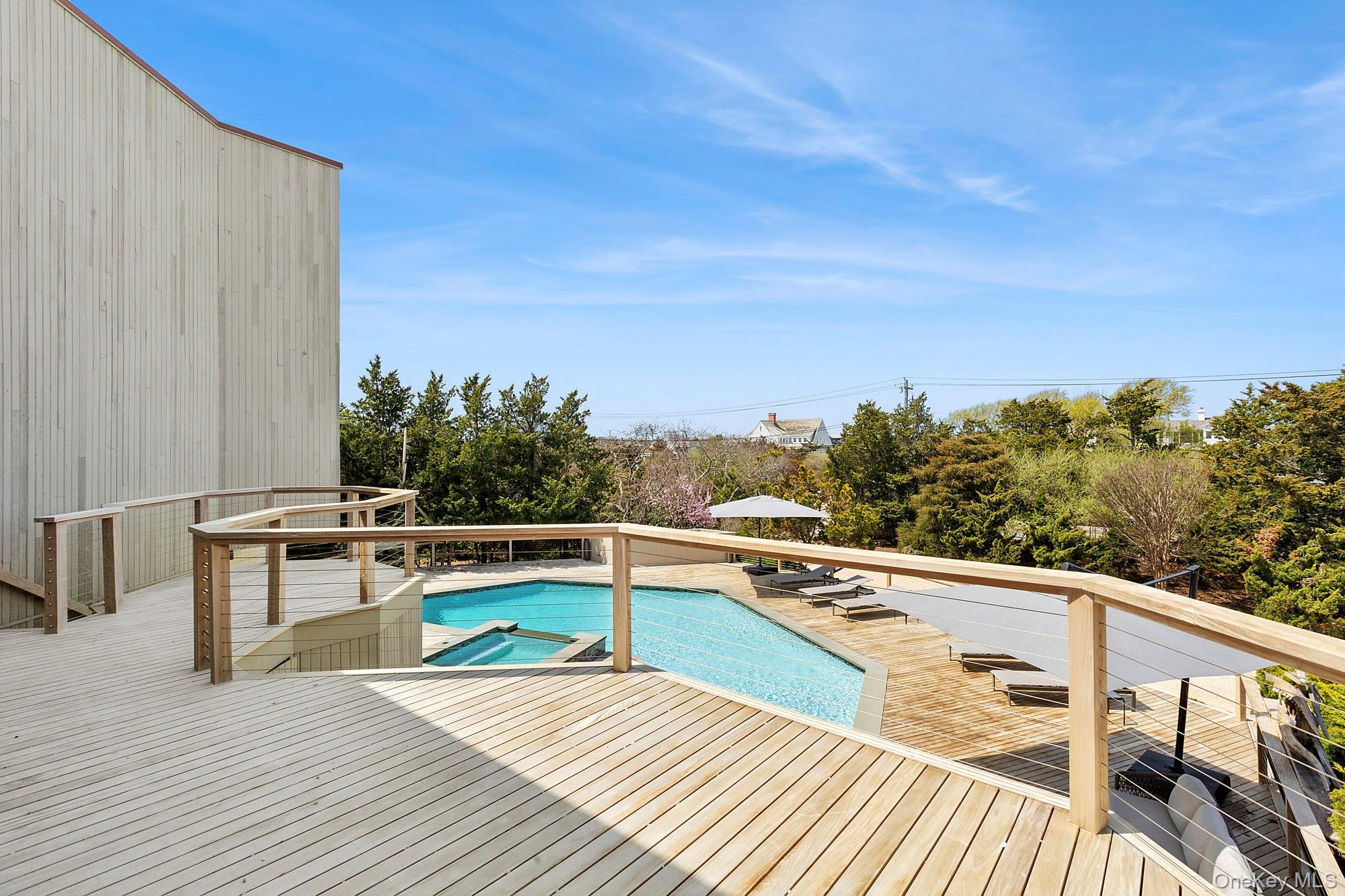 199 Dune Road Westhampton Beach, NY 11978 - Photo 34 of 38 a view of balcony with furniture
