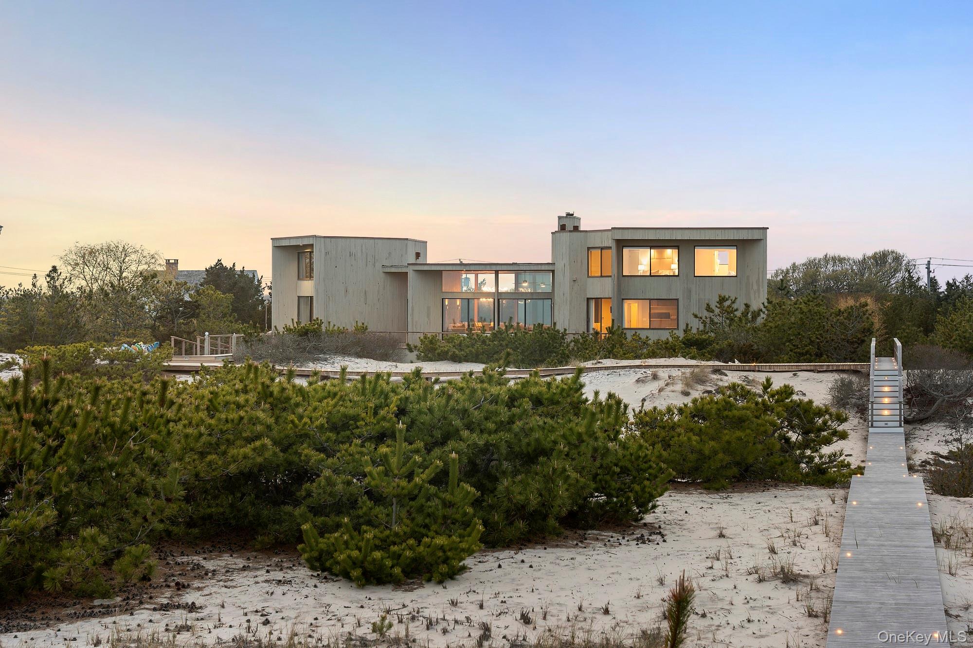 199 Dune Road Westhampton Beach, NY 11978 - Photo 38 of 38 a view of a large building with a yard