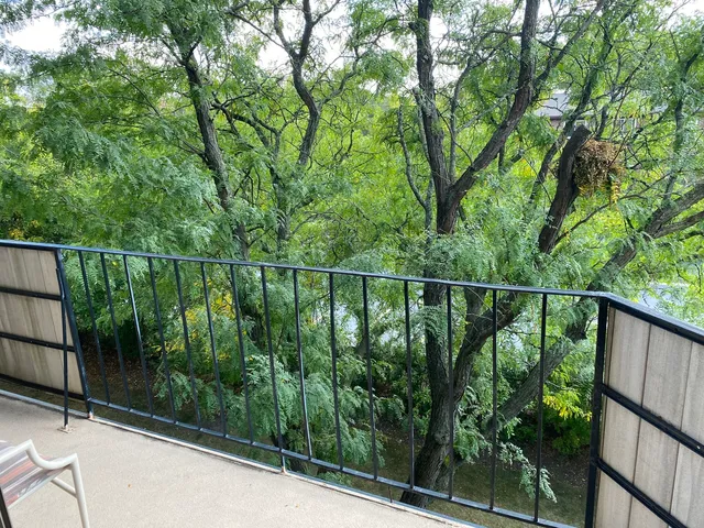 a view of a hallway view with wooden floor and staircase