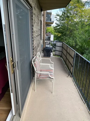 a bedroom with a bed and a mirror