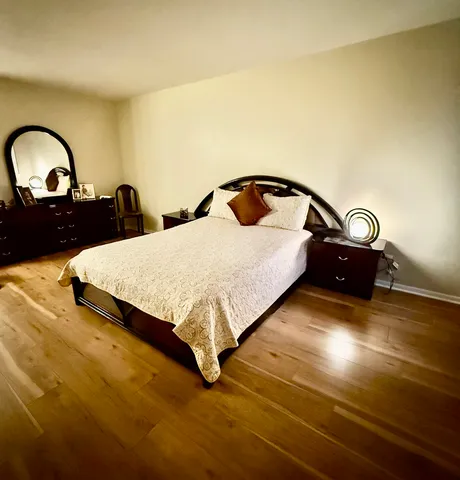 a bedroom with a bed and a closet