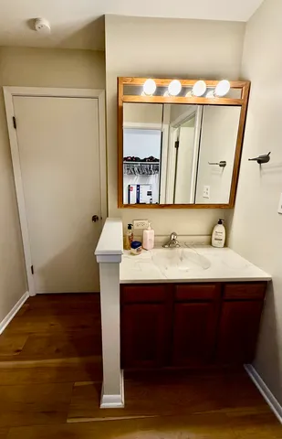 a bathroom with a sink toilet and shower