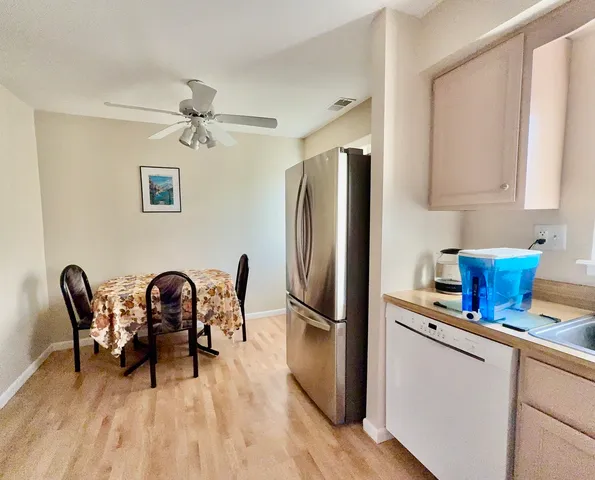 a kitchen with stainless steel appliances granite countertop a stove and a microwave