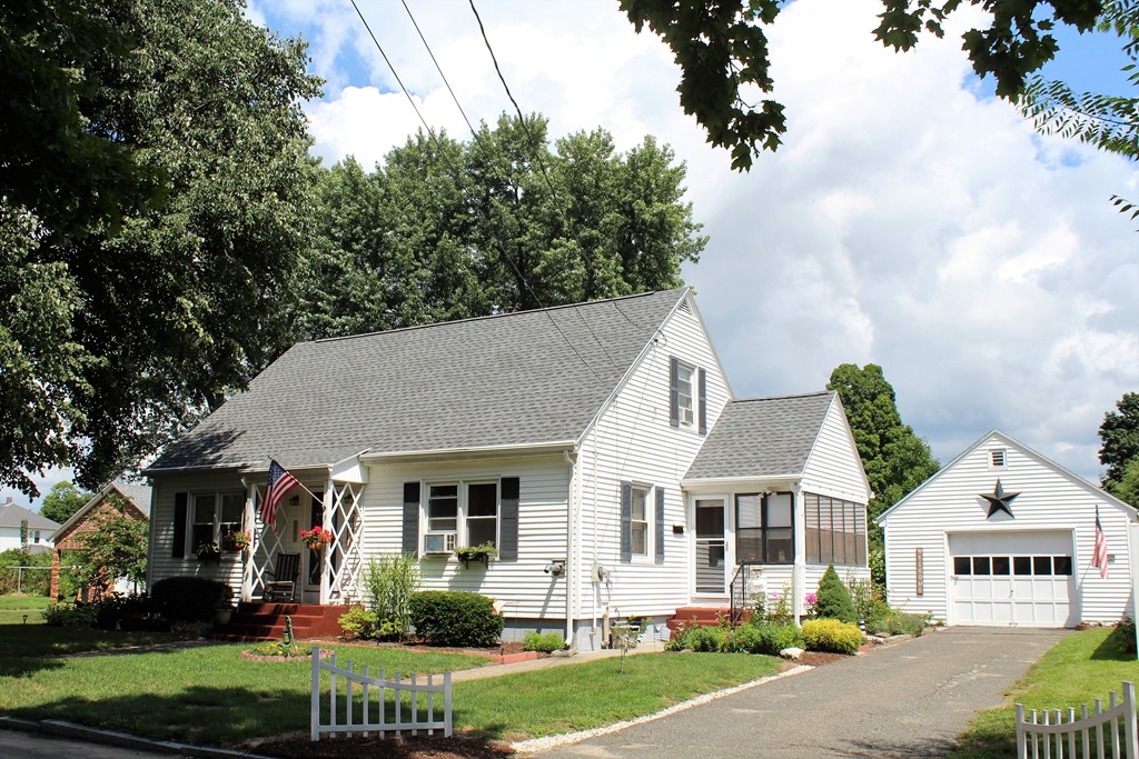 65 Primrose Street Springfield, MA 01151 - Photo 1 of 30 front view of a house with a yard