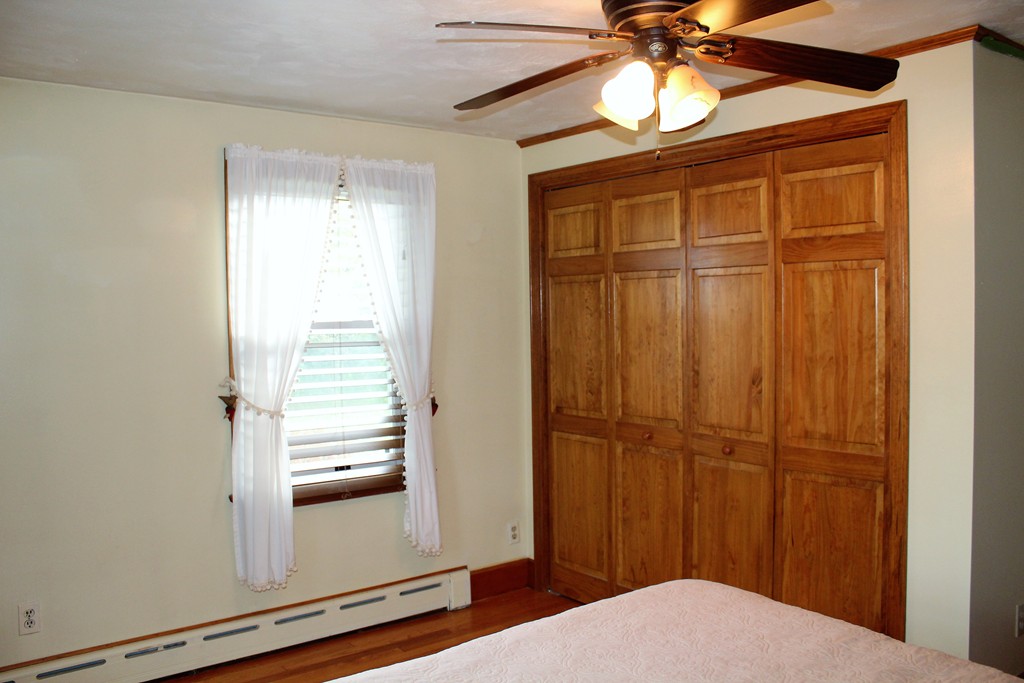 65 Primrose Street Springfield, MA 01151 - Photo 22 of 30 a view of a livingroom with a chandelier fan