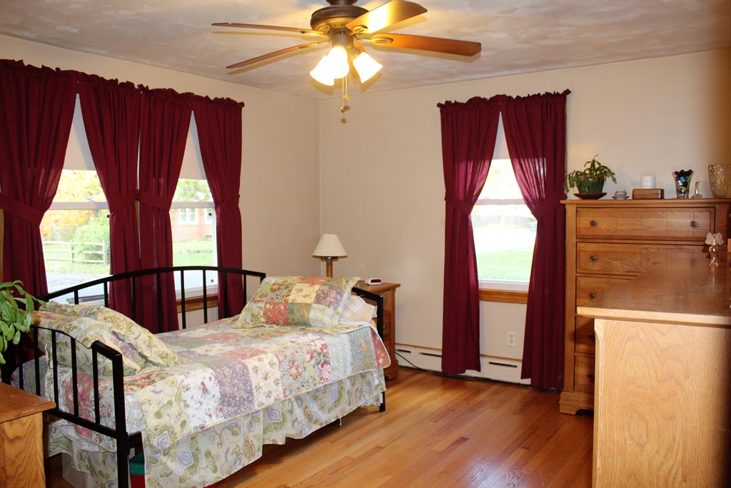 65 Primrose Street Springfield, MA 01151 - Photo 23 of 30 a bedroom with a bed a window and dresser