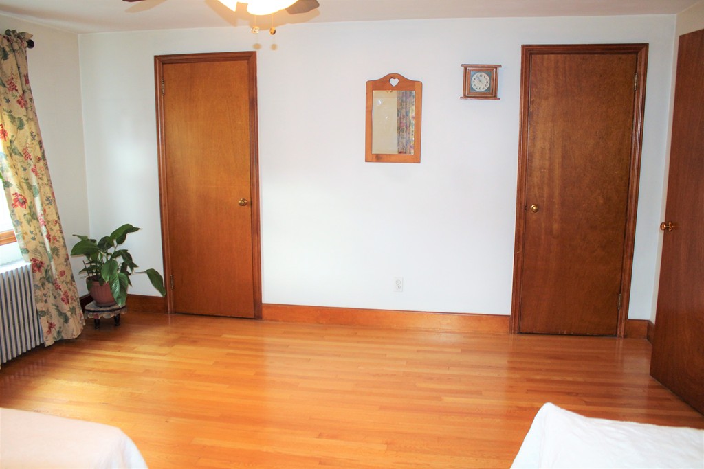65 Primrose Street Springfield, MA 01151 - Photo 28 of 30 a view of an empty room with wooden floor