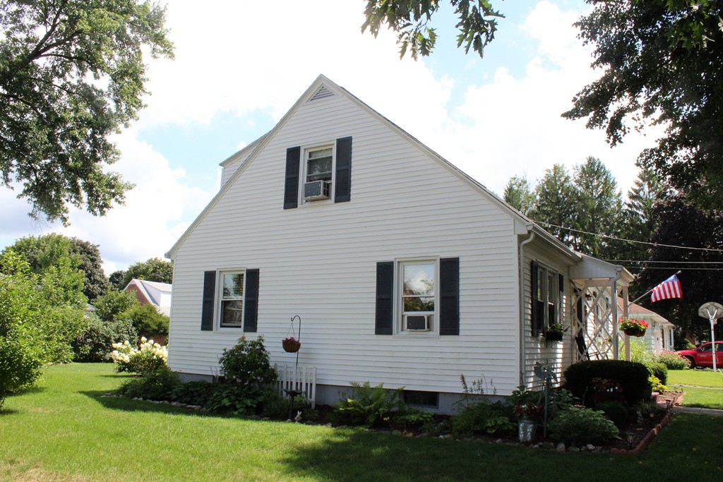 65 Primrose Street Springfield, MA 01151 - Photo 3 of 30 a front view of a house with a garden