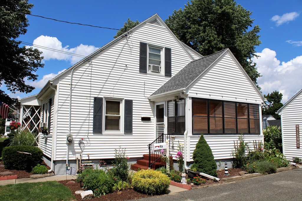 65 Primrose Street Springfield, MA 01151 - Photo 8 of 30 a front view of a house with a yard
