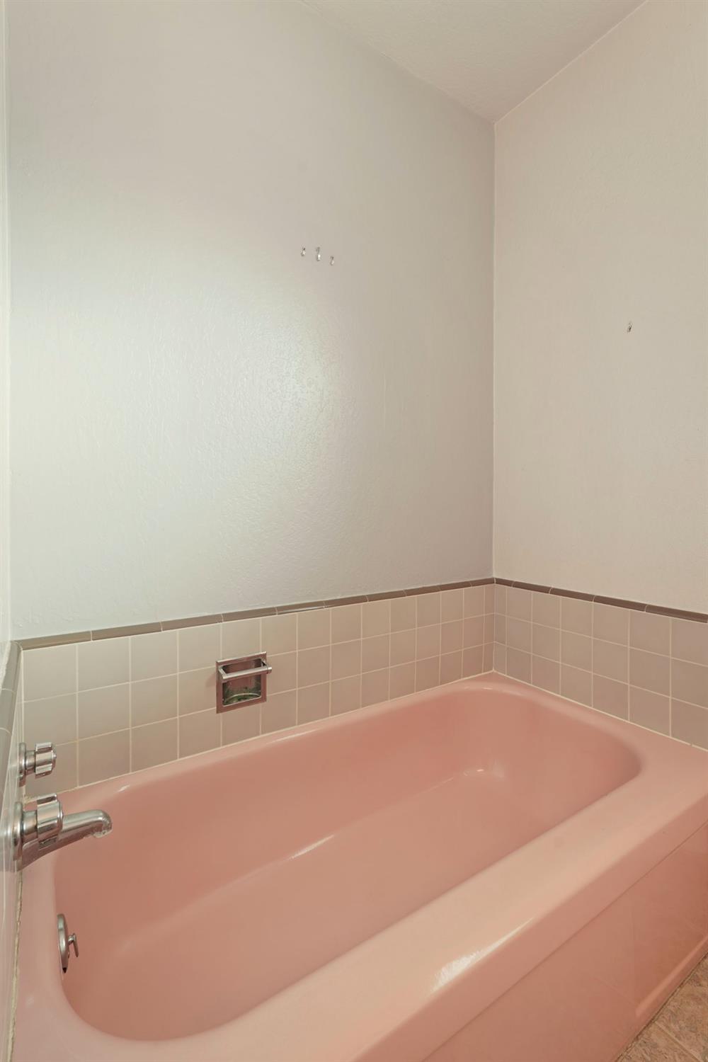 1007 Cardinal Street Lodi, CA 95240 - Photo 16 of 31 a white bath tub sitting in a bathroom