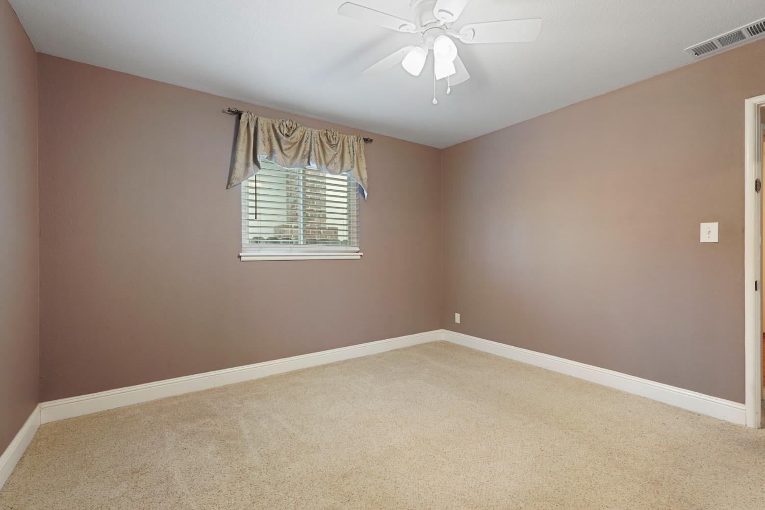 1007 Cardinal Street Lodi, CA 95240 - Photo 21 of 31 an empty room with a window