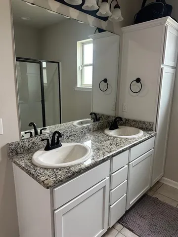 a white bath tub sitting next to a white sink