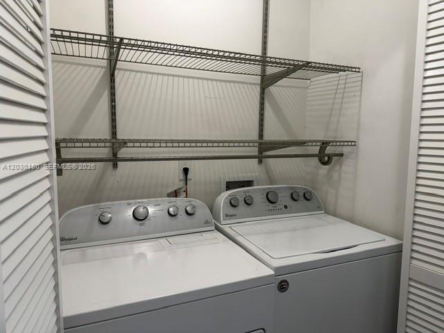11206 Southwest 125th Place, Unit 11206 Miami, FL 33186 - Photo 8 of 15 a utility room with dryer and washer