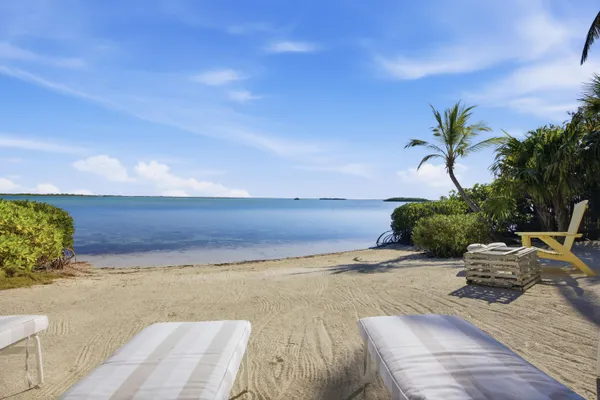 a bedroom with furniture and a wooden floor