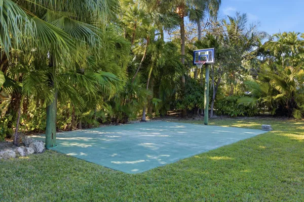 a living room with lots of furniture and white walls
