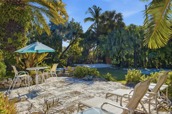 a view of a porch with furniture and next to a window