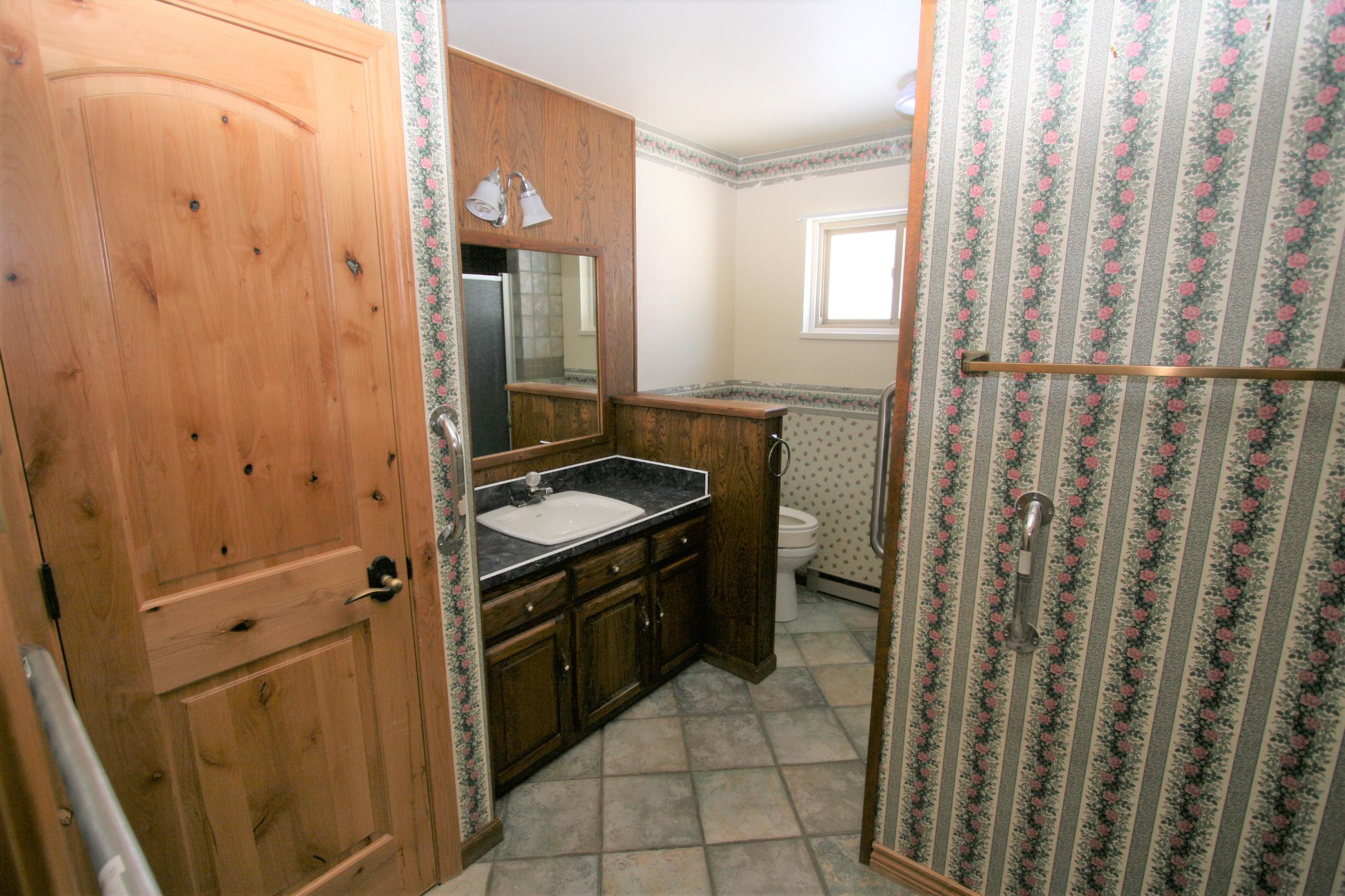 5733 County Road 23 Ridgway, CO 81432 - Photo 13 of 36 a bathroom with a sink a toilet and shower