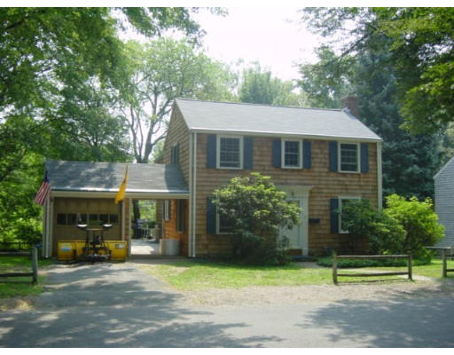 11 Sagamore Road Marblehead, MA 01945 - Photo 1 of 1 a front view of a house with a garden