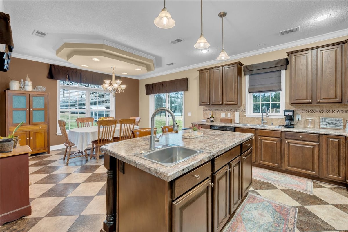 1798 Holly Grove Road Lewisburg, TN 37091 - Photo 13 of 55 a kitchen with center island table and chairs