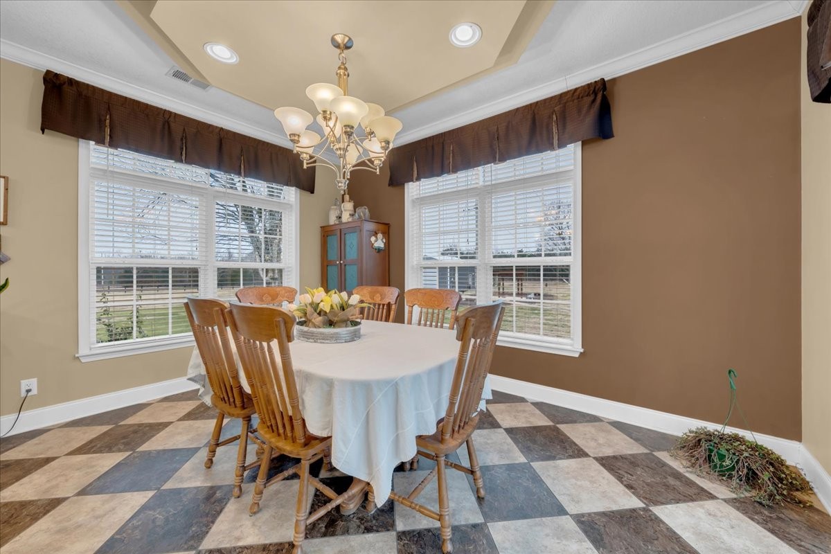 1798 Holly Grove Road Lewisburg, TN 37091 - Photo 18 of 55 a view of a dining room with furniture a chandelier and wooden floor
