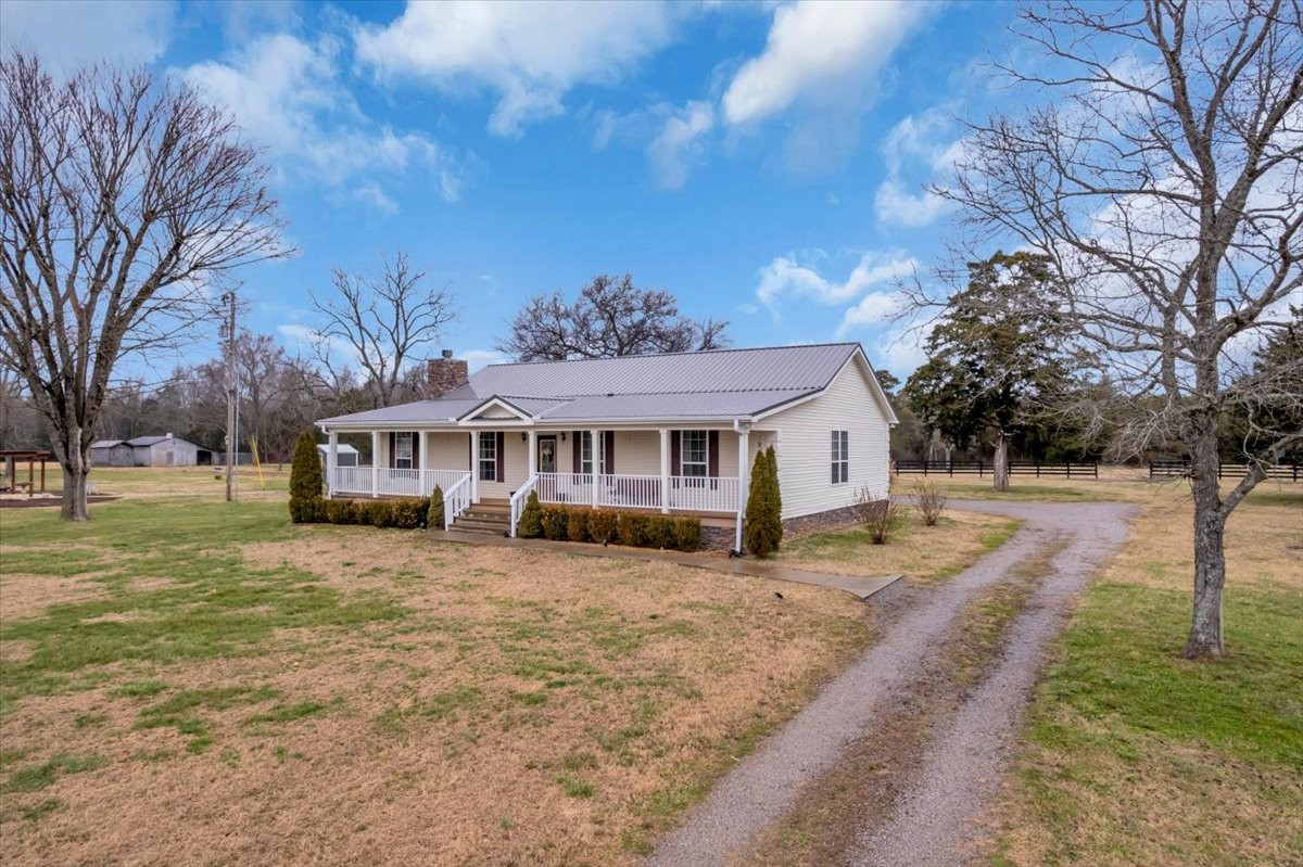 1798 Holly Grove Road Lewisburg, TN 37091 - Photo 2 of 55 a view of a house with a yard covered in snow
