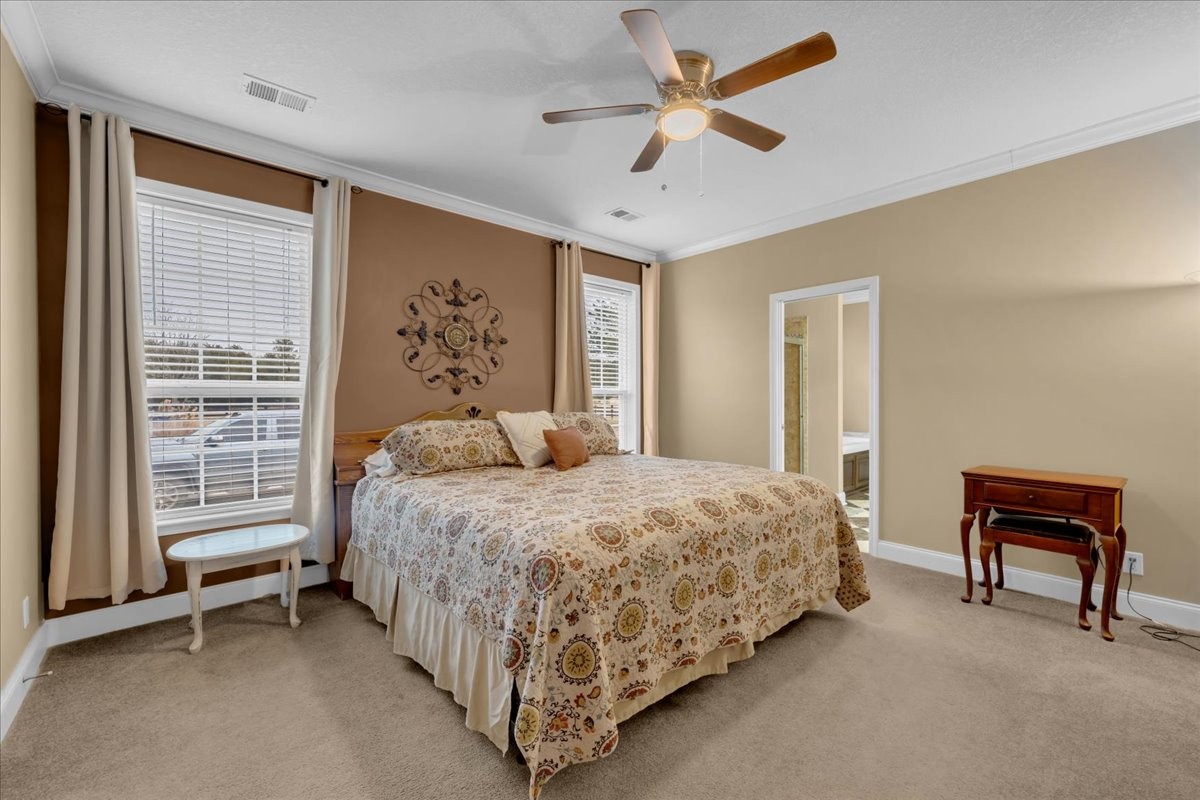 1798 Holly Grove Road Lewisburg, TN 37091 - Photo 21 of 55 a bedroom with a bed and a chandelier