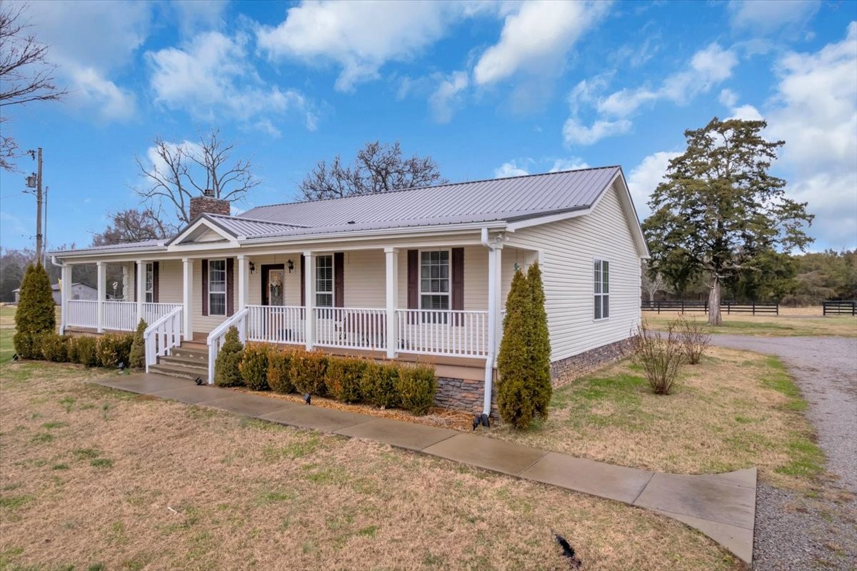 1798 Holly Grove Road Lewisburg, TN 37091 - Photo 49 of 55 a front view of a house with garden