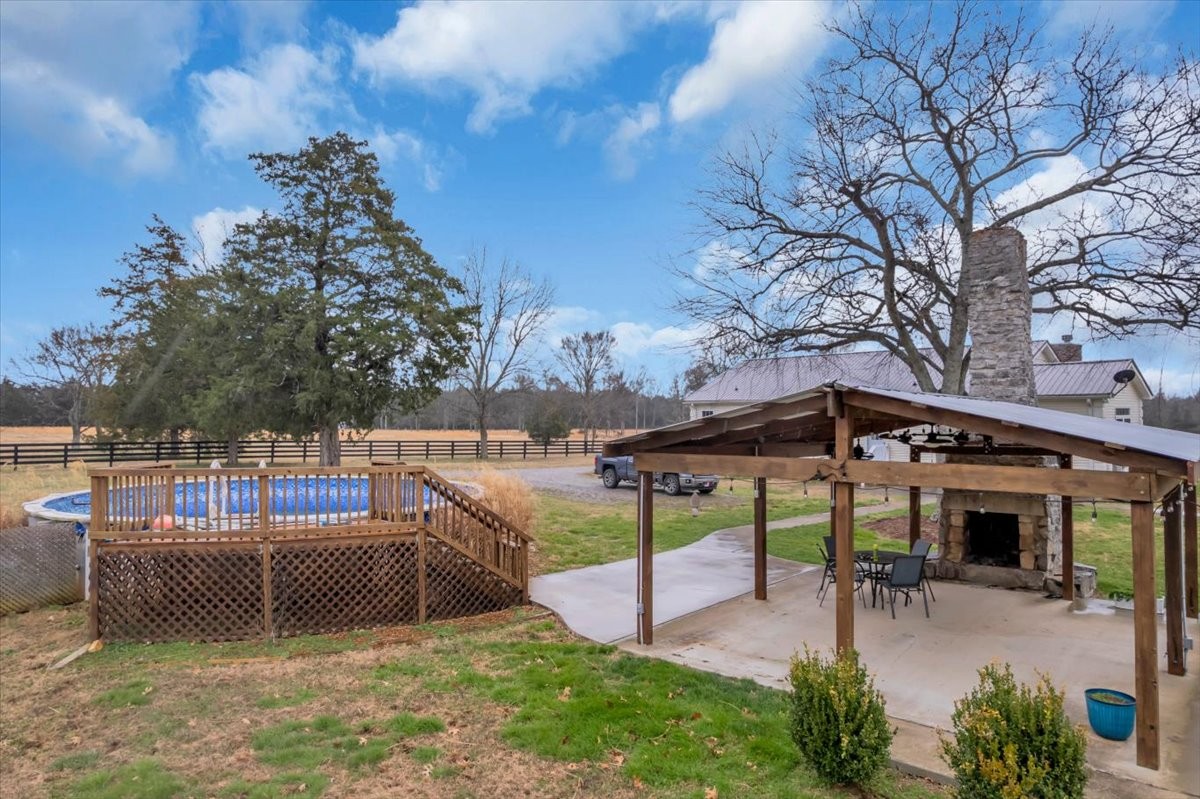 1798 Holly Grove Road Lewisburg, TN 37091 - Photo 52 of 55 a view of a swimming pool with chairs and table in the patio