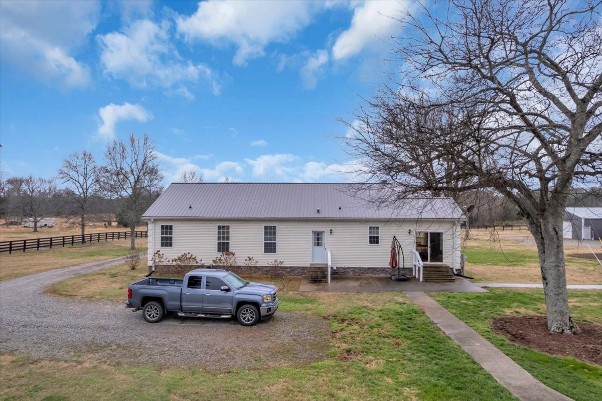 1798 Holly Grove Road Lewisburg, TN 37091 - Photo 53 of 55 a car parked in front of a house
