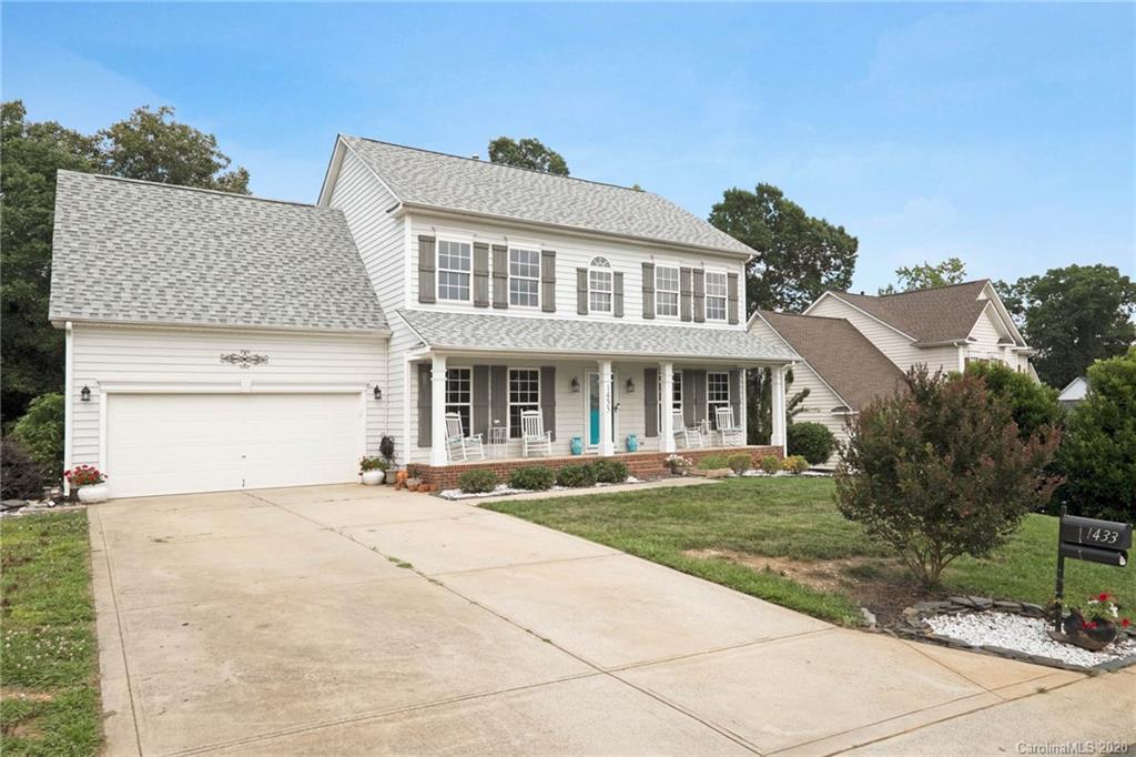 1433 Autumn Ridge Lane Fort Mill, SC 29708 - Photo 1 of 38 a front view of house with yard and green space