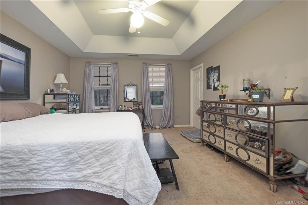 1433 Autumn Ridge Lane Fort Mill, SC 29708 - Photo 21 of 38 a bed room with a bed and a dresser