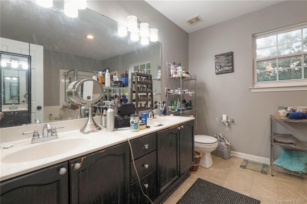 1433 Autumn Ridge Lane Fort Mill, SC 29708 - Photo 23 of 38 a bathroom with a double vanity sink toilet and a mirror