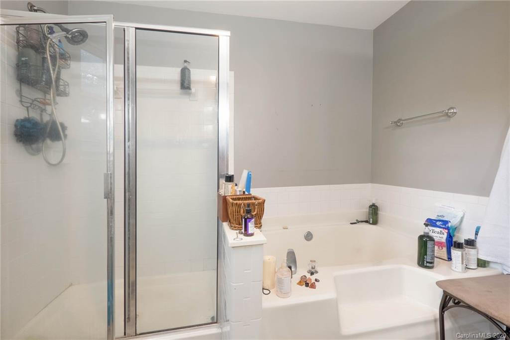 1433 Autumn Ridge Lane Fort Mill, SC 29708 - Photo 24 of 38 a bathroom with a bathtub and a shower