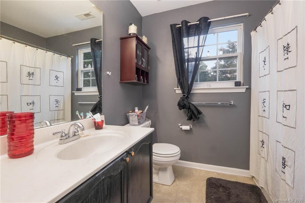 1433 Autumn Ridge Lane Fort Mill, SC 29708 - Photo 25 of 38 a bathroom with a sink toilet and shower