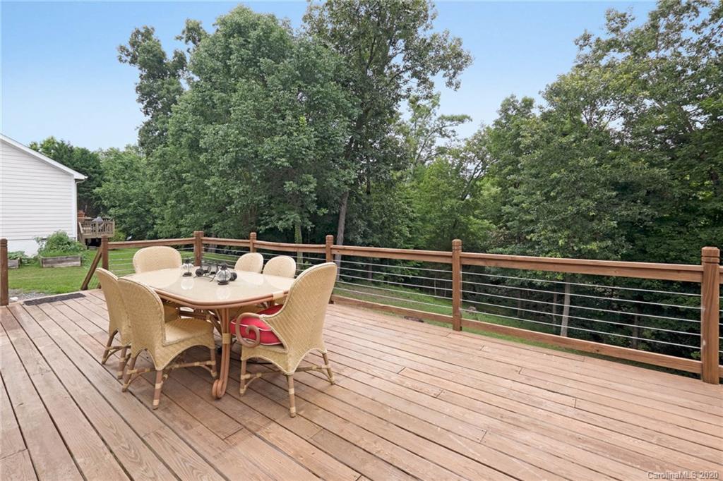1433 Autumn Ridge Lane Fort Mill, SC 29708 - Photo 31 of 38 a roof deck with chairs and wooden floor