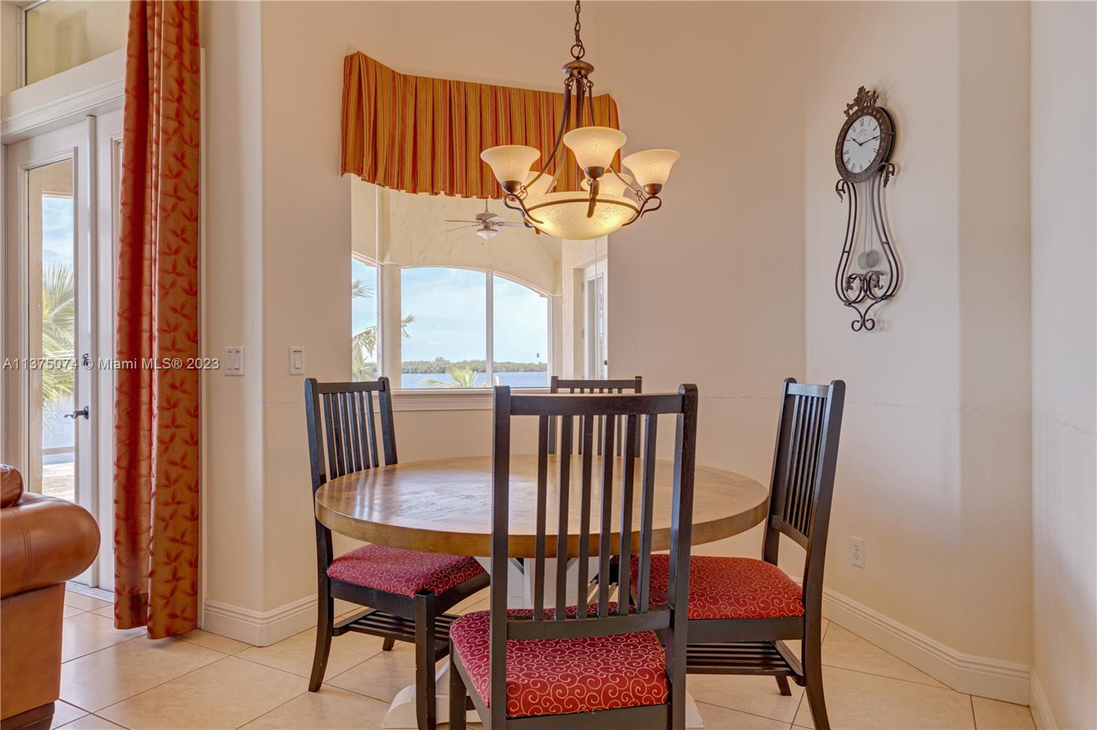 258 Bimini Road Cocoa Beach, FL 32931 - Photo 17 of 43 a view of a dining room with furniture window and outside view