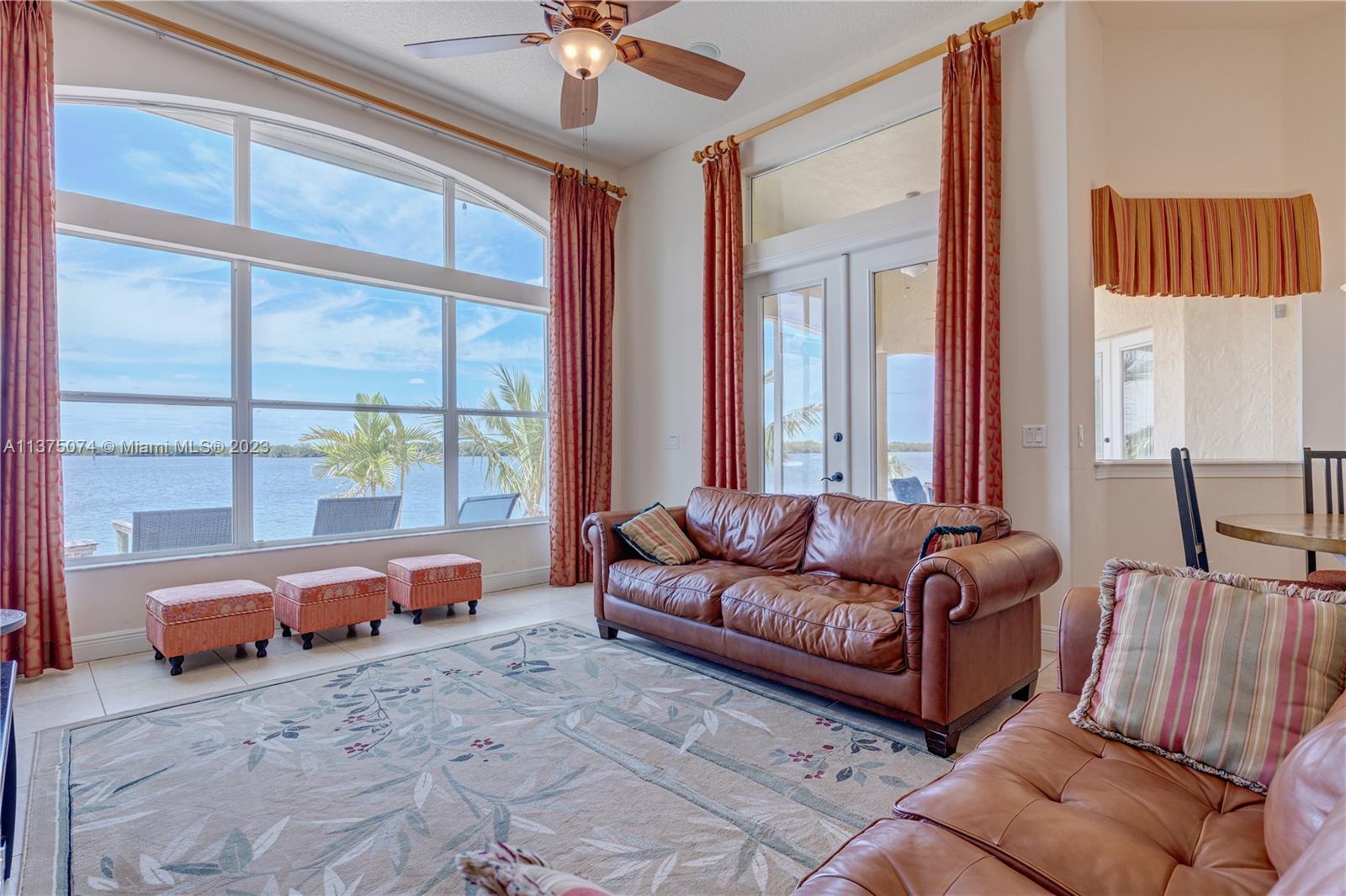 258 Bimini Road Cocoa Beach, FL 32931 - Photo 20 of 43 a living room with furniture and a large window