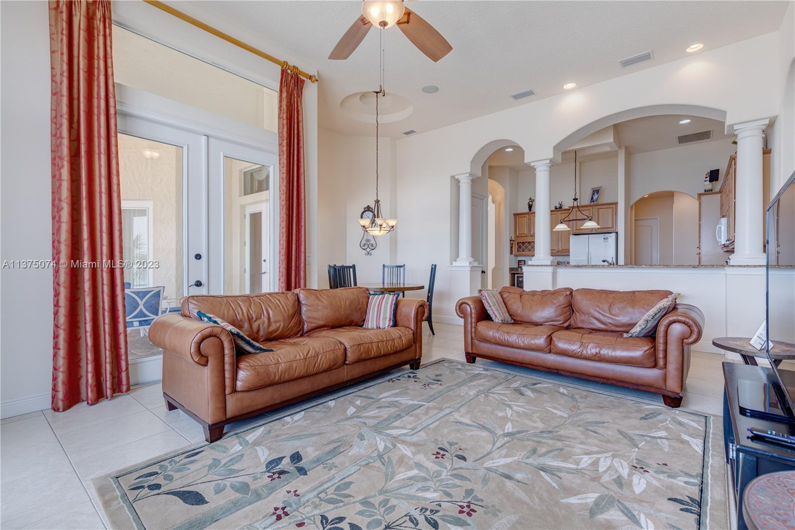 258 Bimini Road Cocoa Beach, FL 32931 - Photo 21 of 43 a living room with furniture and a fireplace