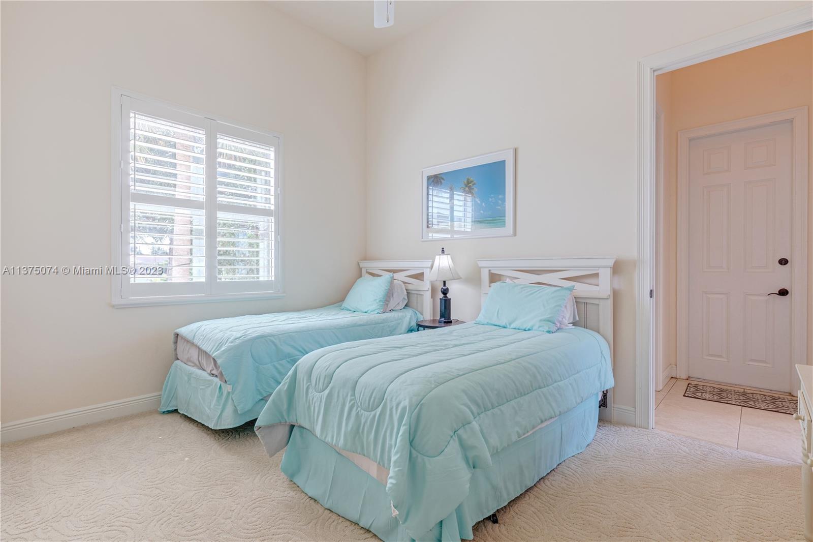 258 Bimini Road Cocoa Beach, FL 32931 - Photo 23 of 43 a bedroom with a bed and a window