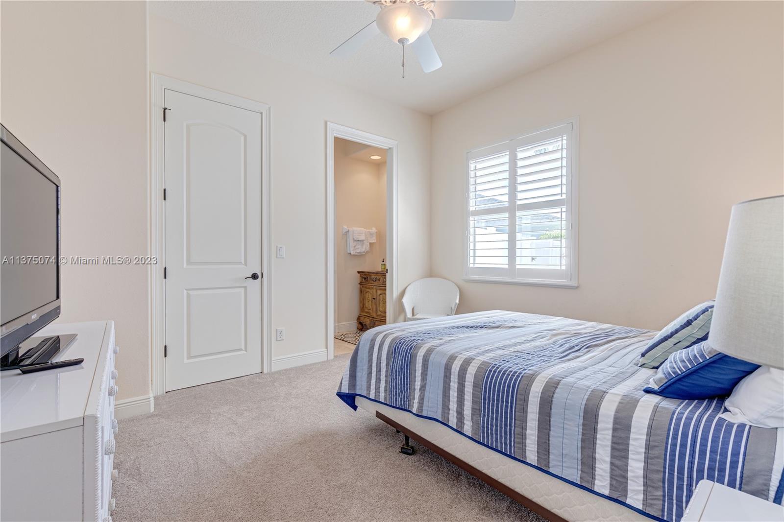 258 Bimini Road Cocoa Beach, FL 32931 - Photo 25 of 43 a bedroom with a bed closet and a window