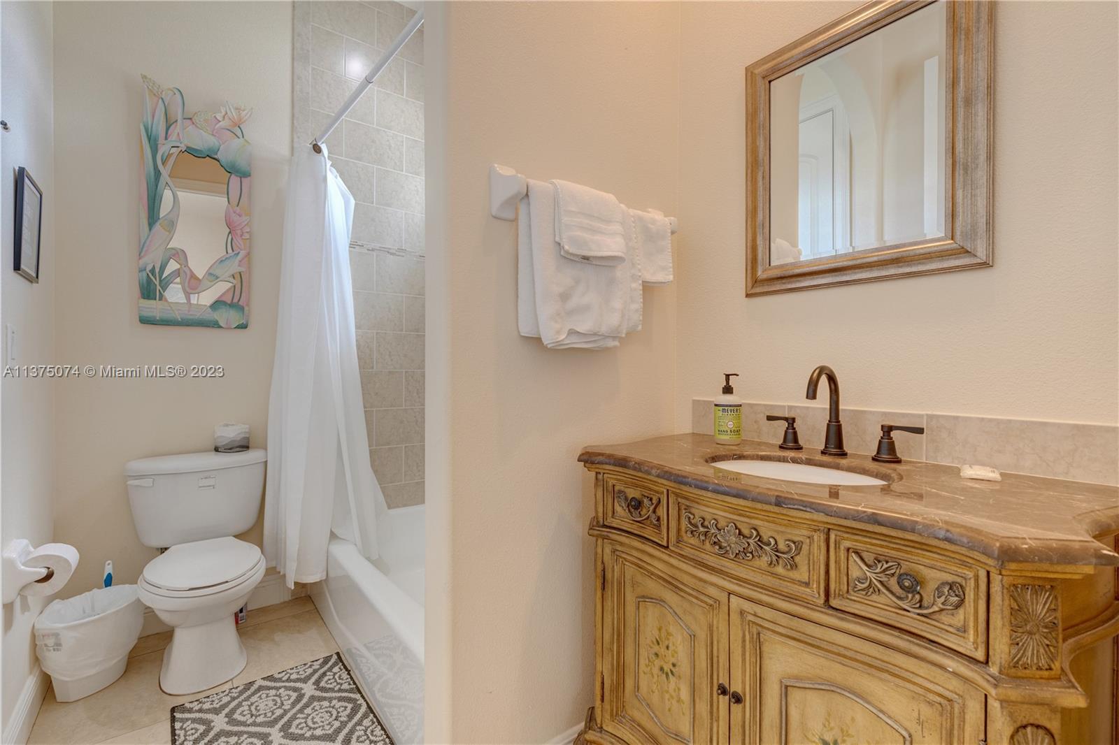 258 Bimini Road Cocoa Beach, FL 32931 - Photo 27 of 43 a view of a bathroom with a sink and a toilet