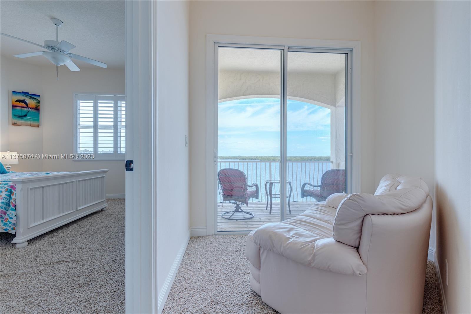 258 Bimini Road Cocoa Beach, FL 32931 - Photo 28 of 43 a living room with furniture and a window