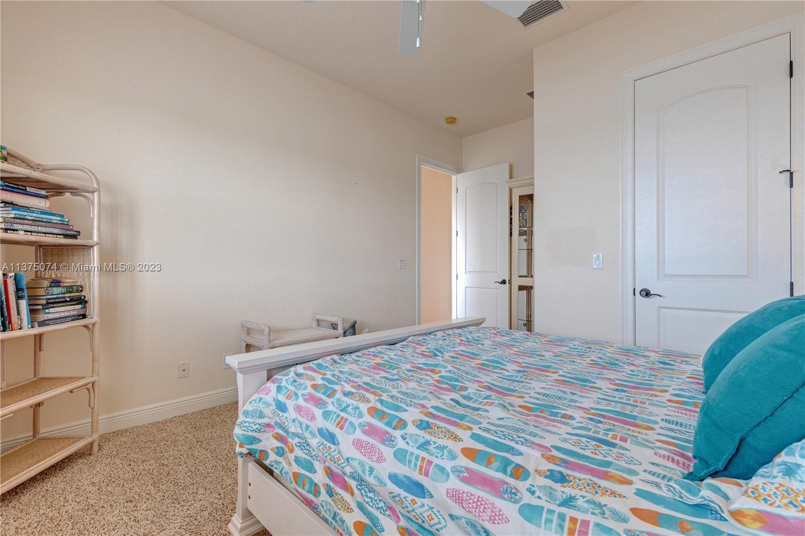 258 Bimini Road Cocoa Beach, FL 32931 - Photo 30 of 43 a bedroom with a bed and a cabinets