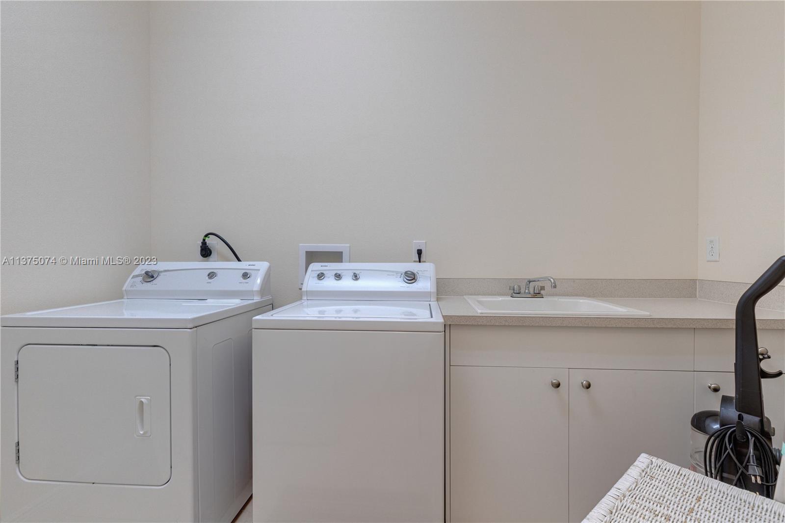 258 Bimini Road Cocoa Beach, FL 32931 - Photo 31 of 43 a utility room with dryer and washer