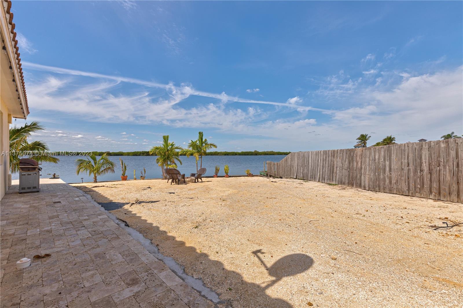 258 Bimini Road Cocoa Beach, FL 32931 - Photo 33 of 43 a view of a backyard of the house